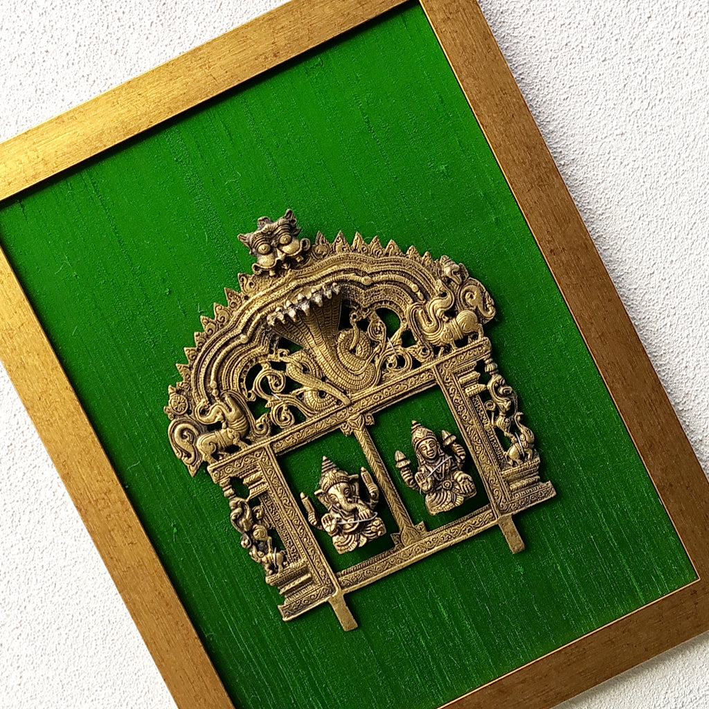 Magnificent Framed Brass Temple Prabhavali With Lord Ganesha & Lakshmi On Green Raw Silk. Ht 45 cm x W 35 cm