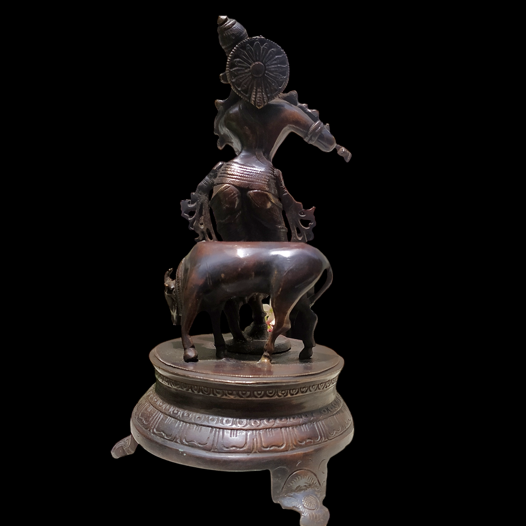 Brass Sculpture of Lord Krishna With The Sacred Cow In A Rich Dark Brown Patina - Ht 25 cm