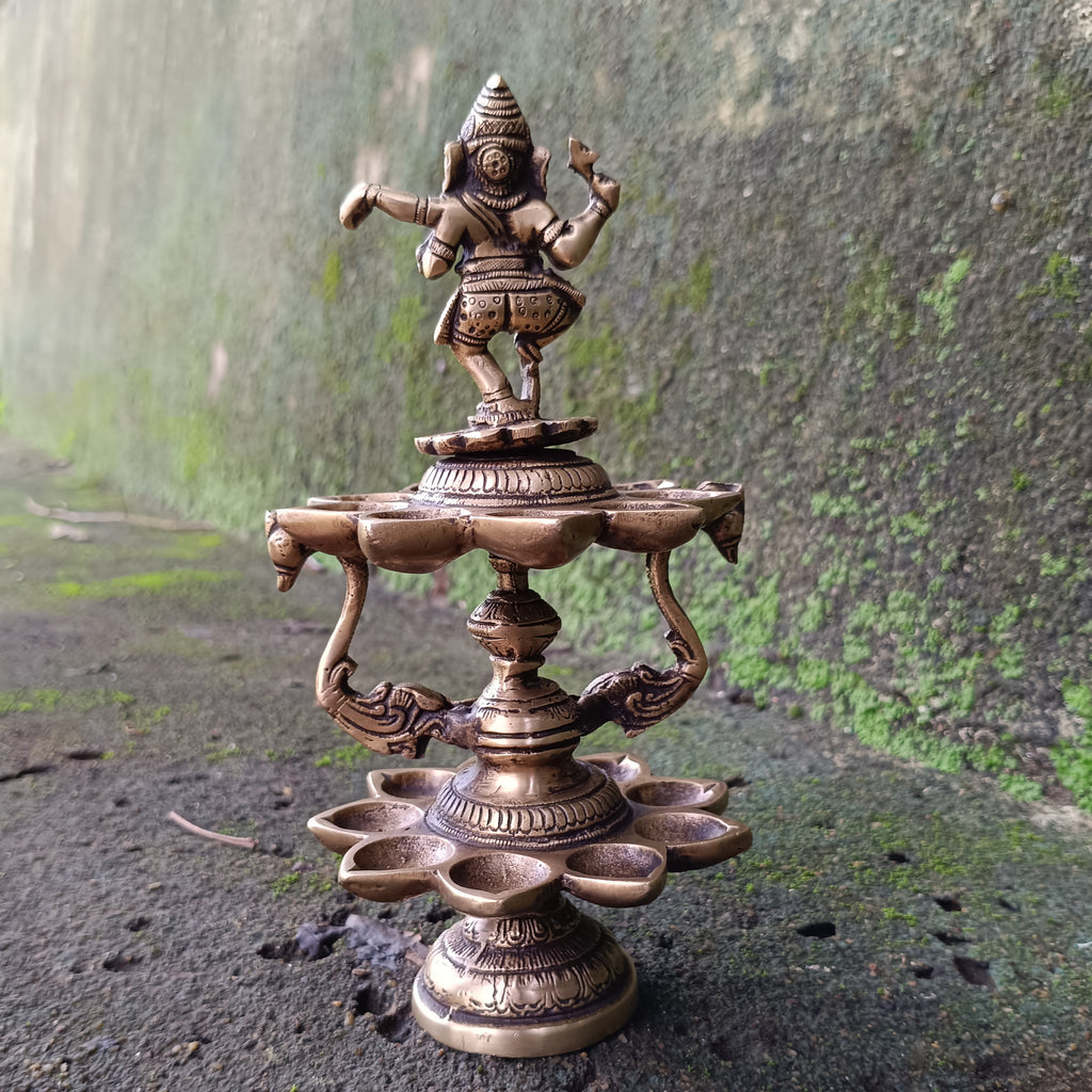 Divine Brass Lamp Of Dancing Ganesha With 18 Oil Diyas. Height 25 cm x Diameter 12 cm