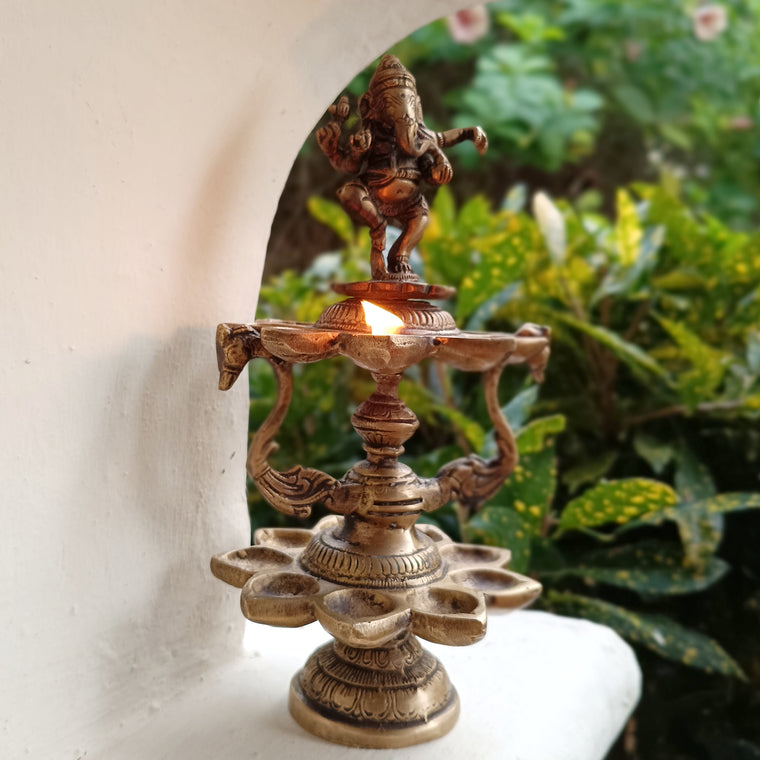 Divine Brass Lamp Of Dancing Ganesha With 18 Oil Diyas. Height 25 cm x Diameter 12 cm