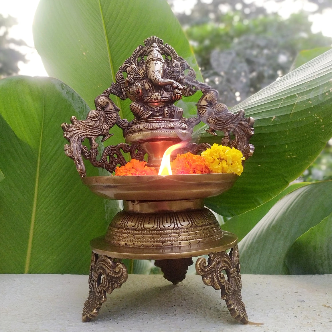 Majestic Brass Oil Lamp Of Lord Ganesha Crafted With Twin Peacocks. Height 34 cm x Width 22 cm X Depth 17 cm