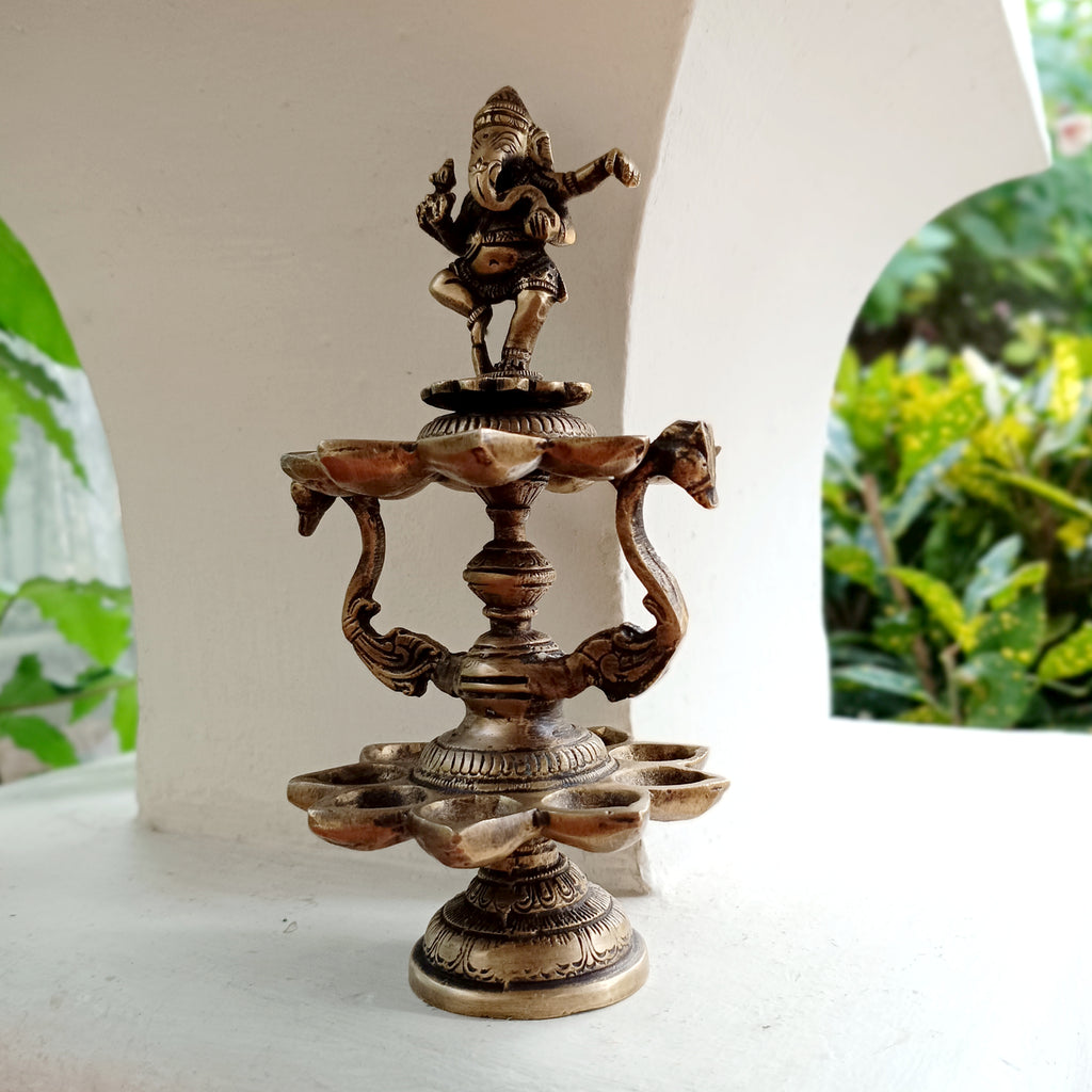Divine Brass Lamp Of Dancing Ganesha With 18 Oil Diyas. Height 25 cm x Diameter 12 cm