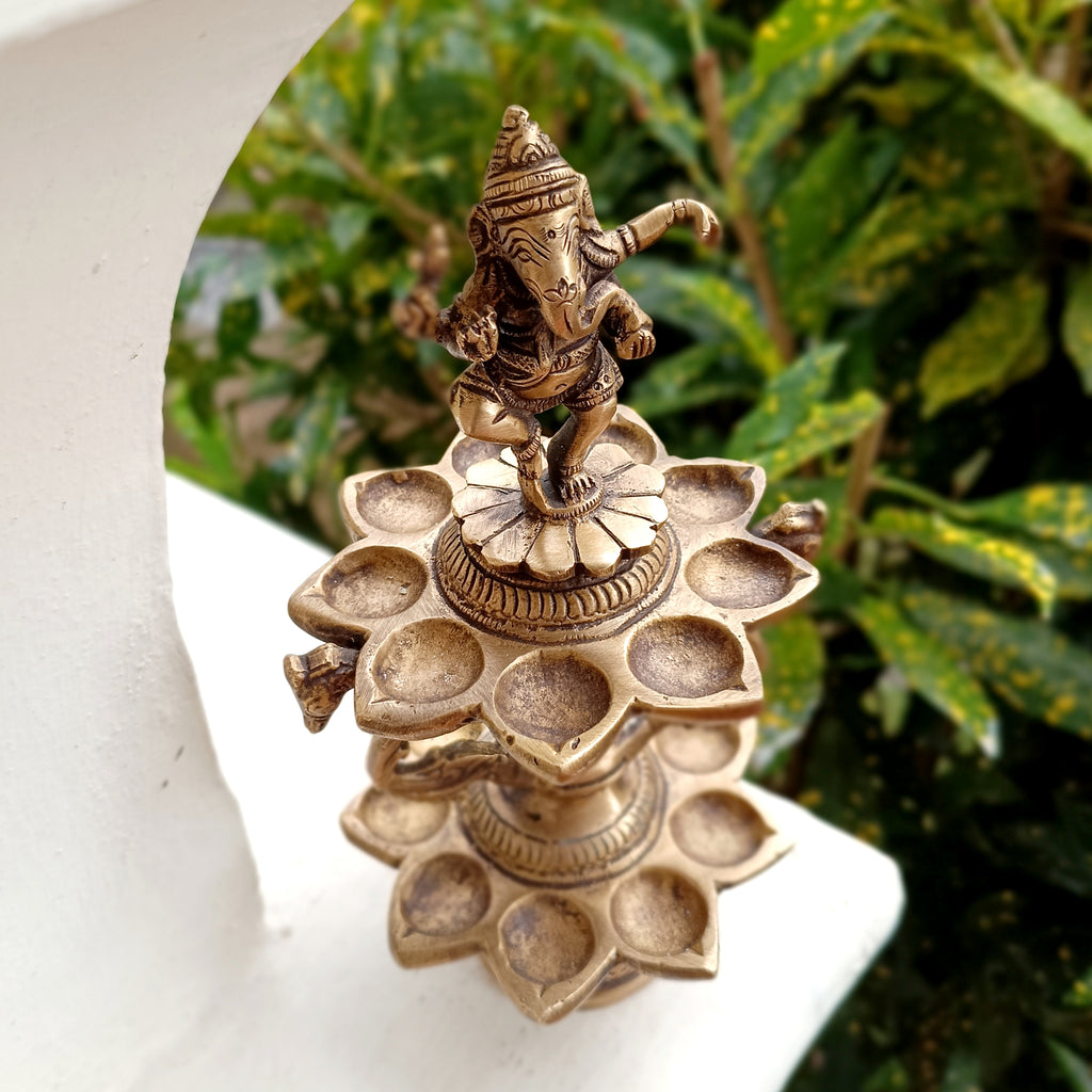Divine Brass Lamp Of Dancing Ganesha With 18 Oil Diyas. Height 25 cm x Diameter 12 cm