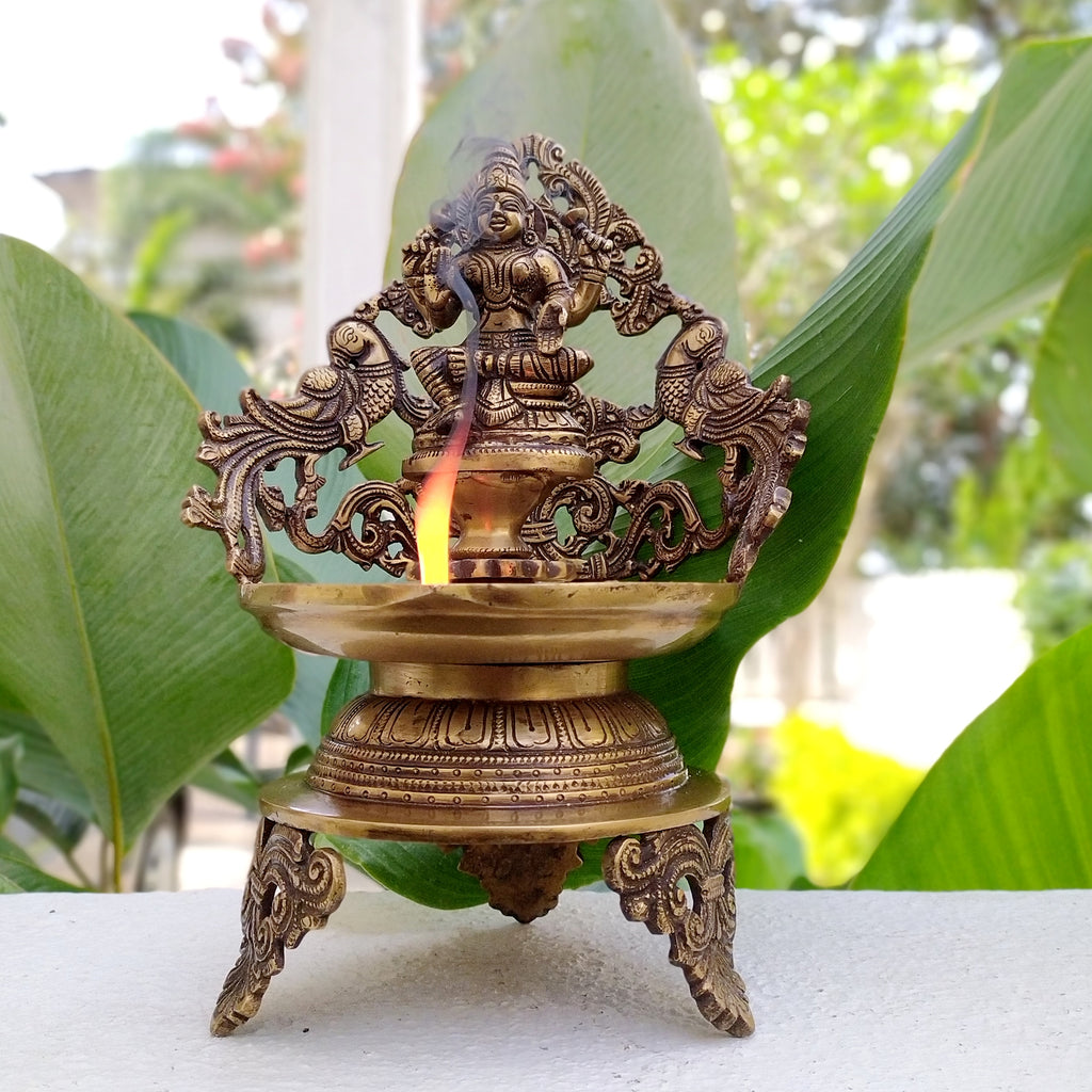 Majestic Brass Oil Lamp Of Goddess Lakshmi Crafted With Twin Peacocks. Height 34 cm x Width 22 cm X Depth 17 cm