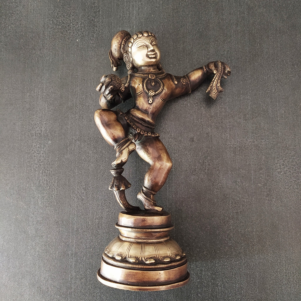 Brass Sculpture of Dancing Krishna Holding A Butter Ball . Height 28 cm x Width 16 cm