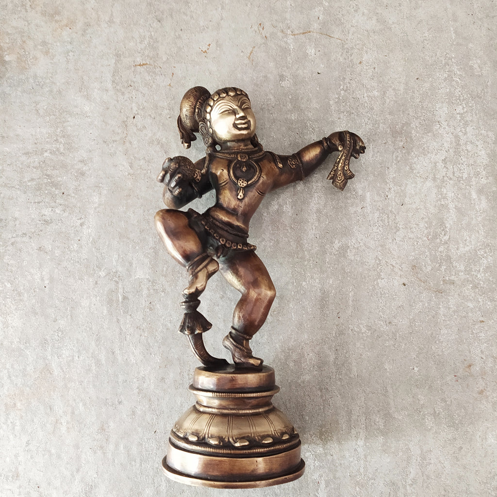 Brass Sculpture of Dancing Krishna Holding A Butter Ball . Height 28 cm x Width 16 cm