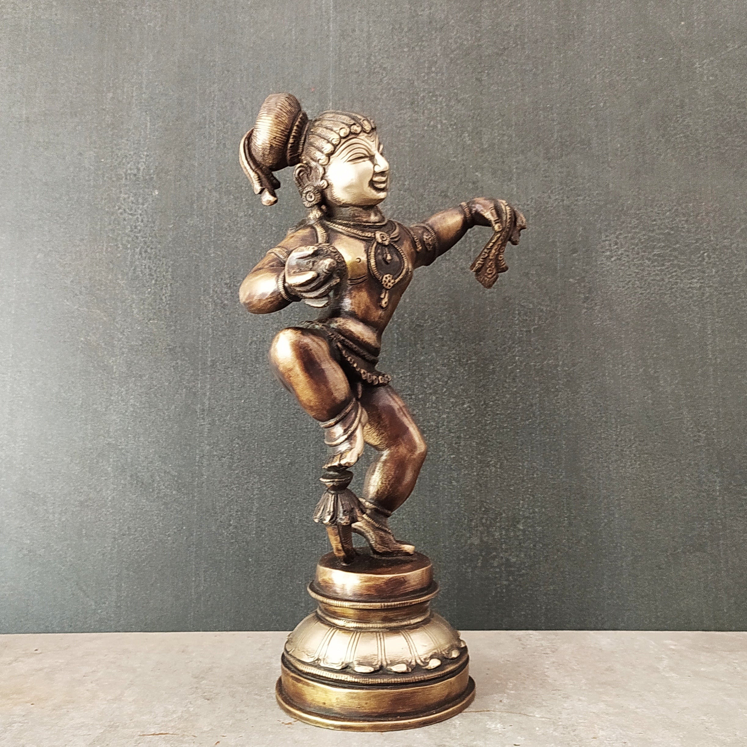 Brass Sculpture of Dancing Krishna Holding A Butter Ball . Height 28 cm x  Width 16 cm