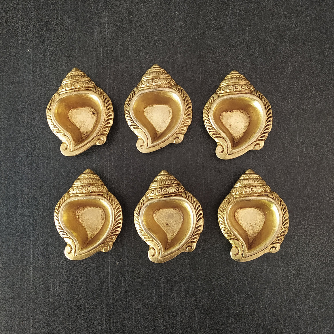 Set of 6 Vintage Hand Casted Festive Conch Shaped Brass Oil Diyas | Lamps With Engravings - L 8 cm X W 6.5 cm X H 2 cm
