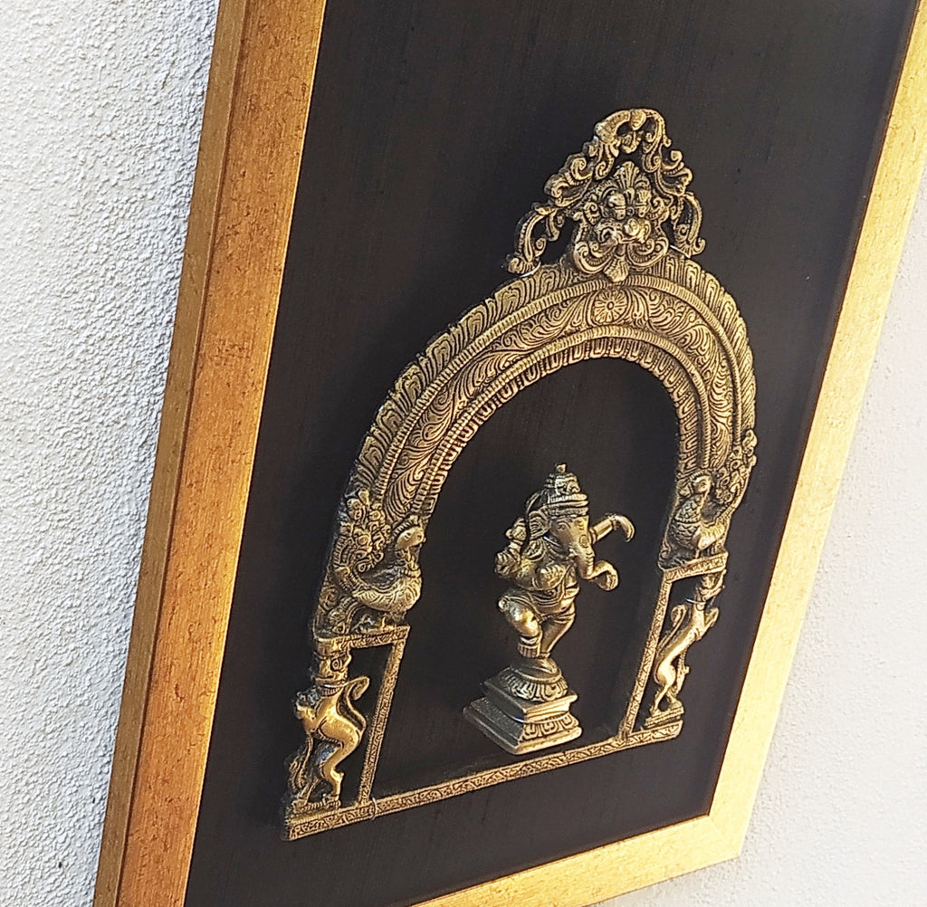 Brass Prabhavali Framed On Black Raw Silk With Dancing Ganesha In Antique Gold Frame. Height 45 cm x Width 35 cm