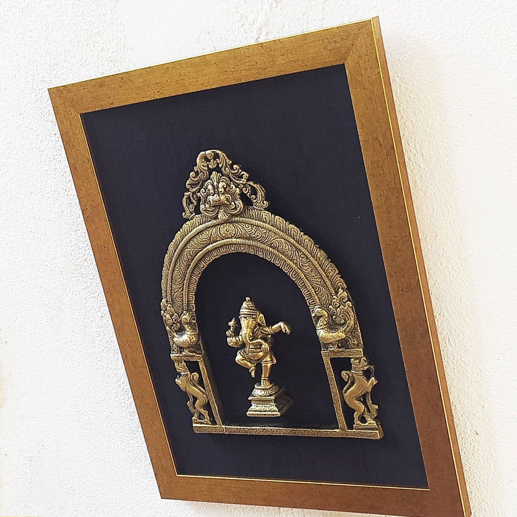 Brass Prabhavali Framed On Black Raw Silk With Dancing Ganesha In Antique Gold Frame. Height 45 cm x Width 35 cm