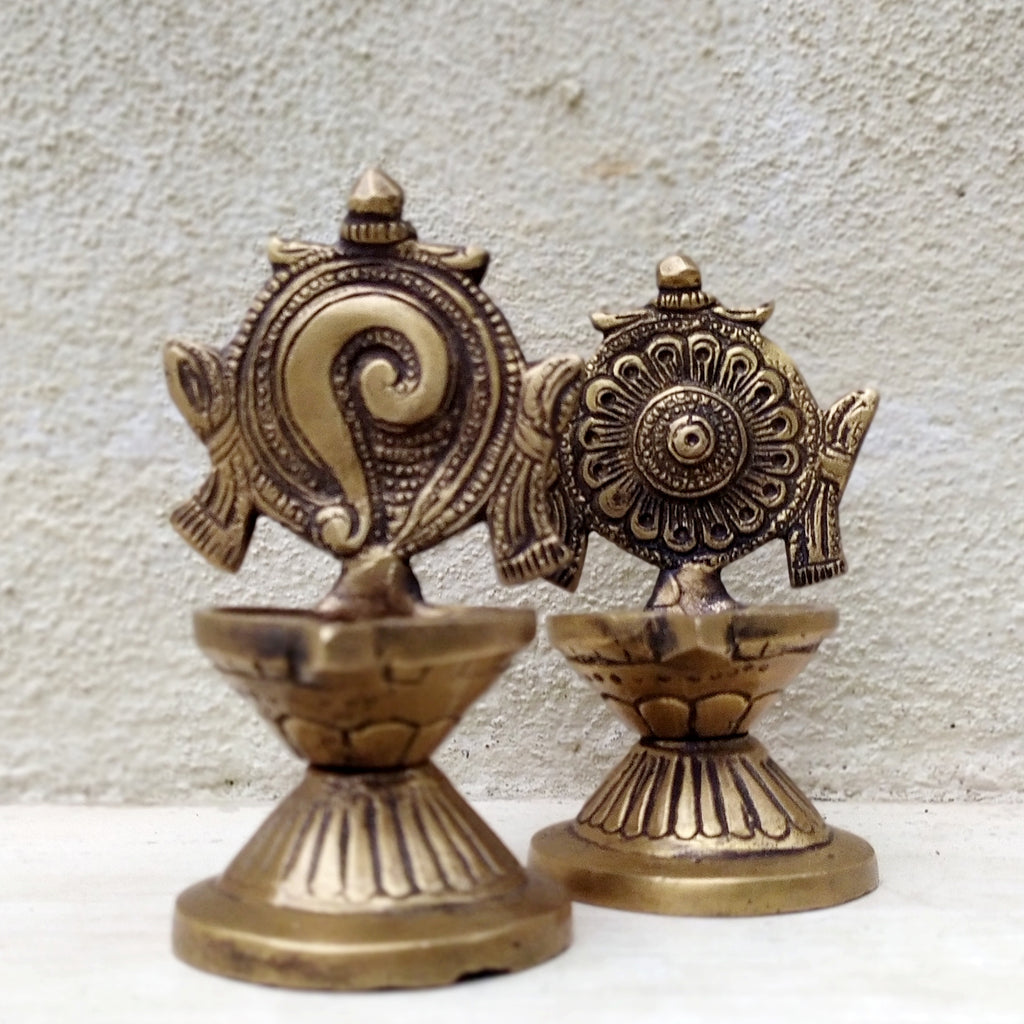 Pair of Brass Sangu Chakara Vishnu Oil Lamps from South India. Ht 11 cm x Dia 5.5 cm