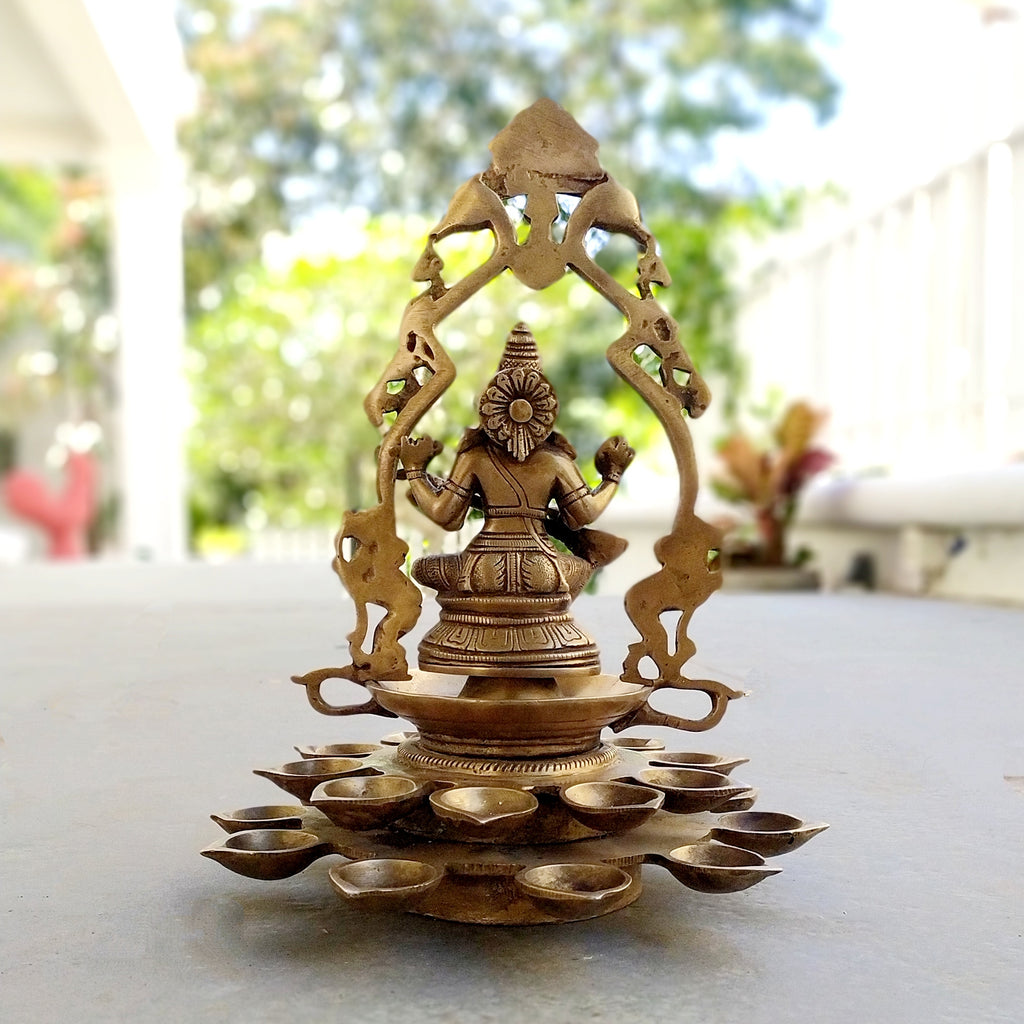 Brass Sculpture Of Saraswati - Goddess of Music, Art and Learning With 20 Diyas. Height 31 cm x Dia 24 cm