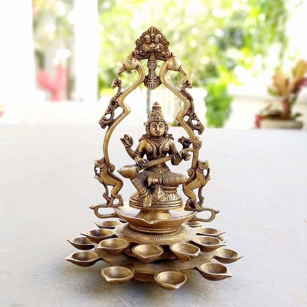 Brass Sculpture Of Saraswati - Goddess of Music, Art and Learning With 20 Diyas. Height 31 cm x Dia 24 cm