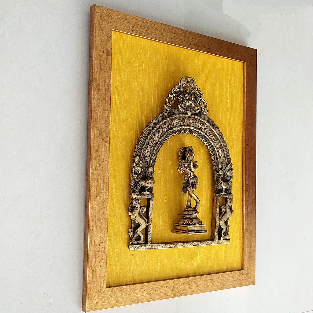 Divine Brass Prabhavali Framed On Gold Yellow Raw Silk With Lord Krishna. Frame Size: Height 45 cm x Width 35 cm