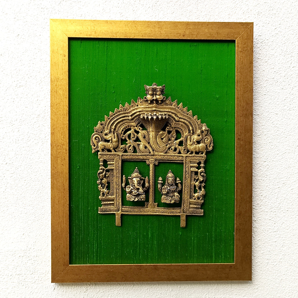 Magnificent Framed Brass Temple Prabhavali With Lord Ganesha & Lakshmi On Green Raw Silk. Ht 45 cm x W 35 cm
