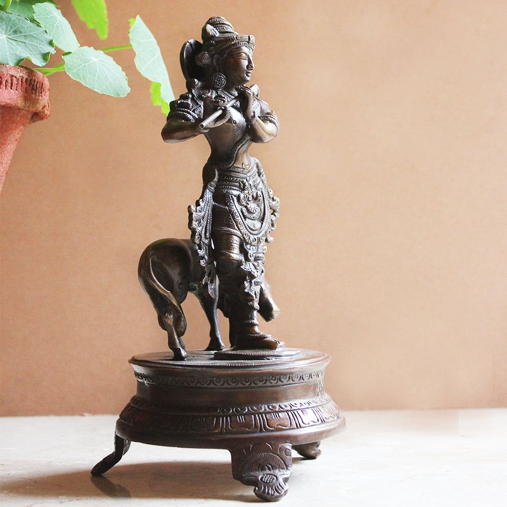 Brass Sculpture of Lord Krishna With The Sacred Cow In Copper & Gold Patina - Ht 25 cm