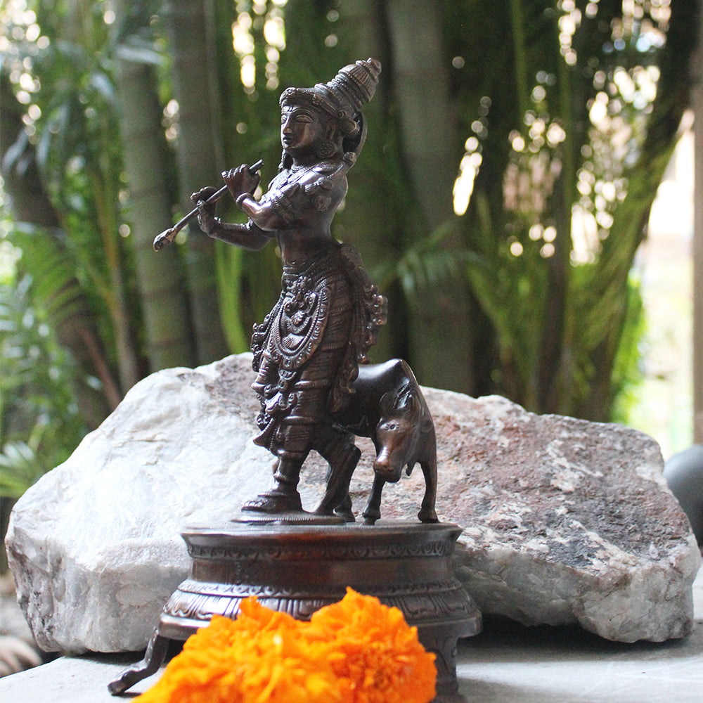 Brass Sculpture of Lord Krishna With The Sacred Cow In A Rich Dark Brown Patina - Ht 25 cm