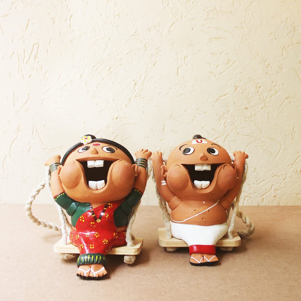 Captivating Terracotta Fun Figures Of Indian Priest & His Wife On Swings - Ht 35 cm x W 13 cm x D 15 cm